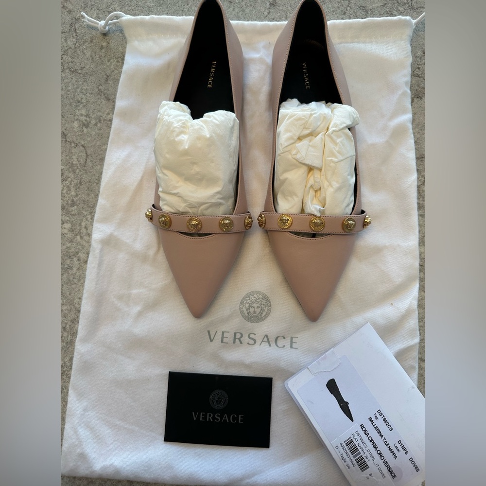 Size 37 BRAND NEW never worn Versace flats comes with dust bag and label
